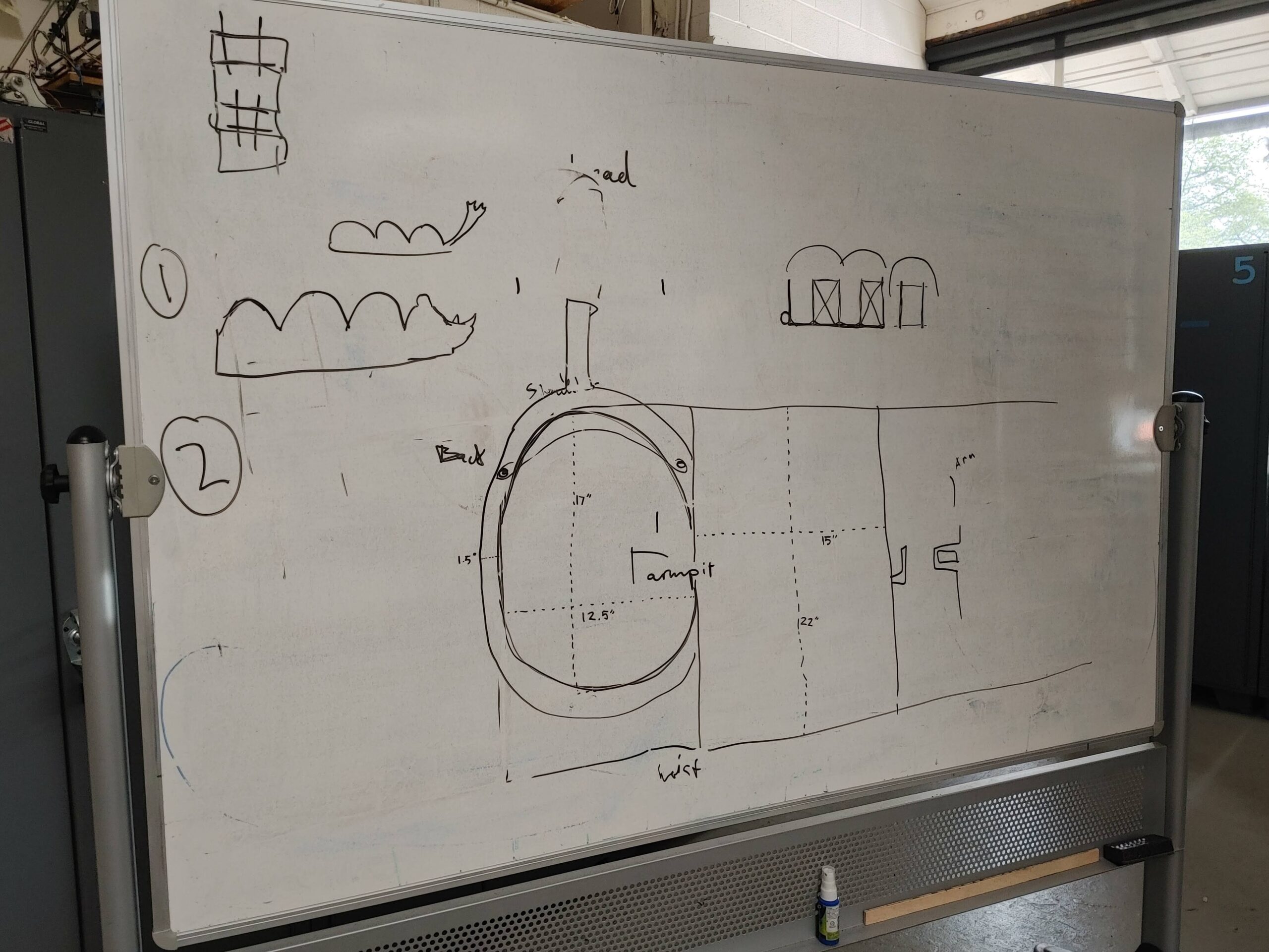 Image of design sketches on a whiteboard.