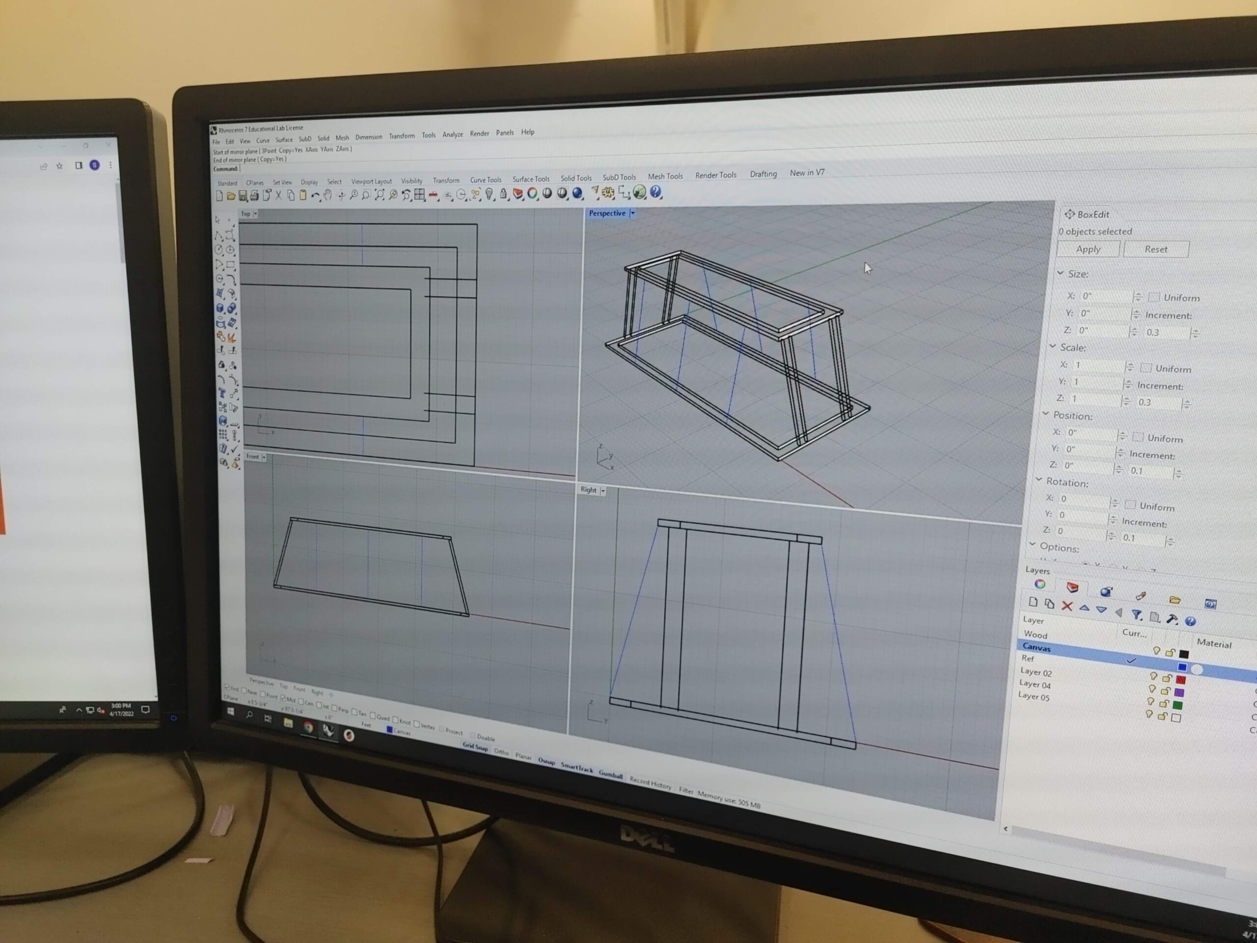 Image of a computer monitor, with an early draft of a chassis design open in Rhino.