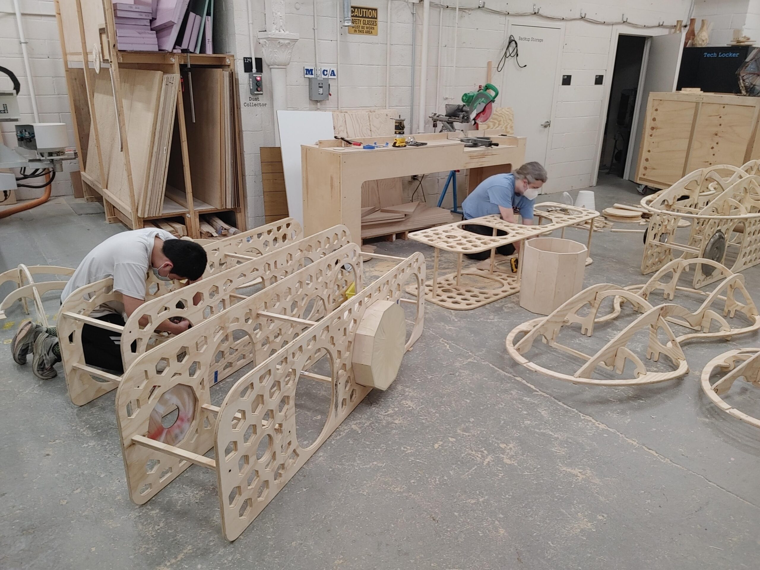 Image of two of my classmates, Tim and Austin, doing final assembly on our chassis pieces.